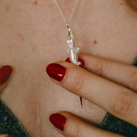 Sterling silver alligator pendant close-up, handcrafted statement necklace, Carolinne B