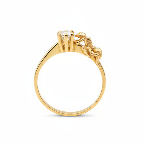 Gold ring with a diamond on a white background