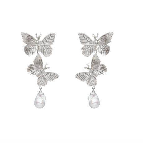 A pair of silver butterfly earrings with two butterflies and a pearl drop. Statement piece