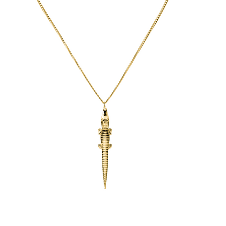 An 18 k gold plated necklace with a polished finish, featuring a stylized alligator pendant. By Swedish Carolinne B jewelry