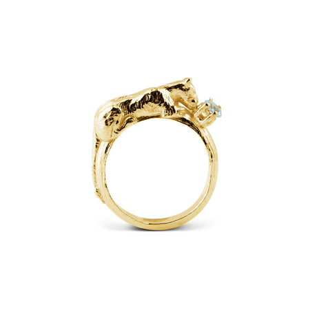 Gold ring with a unique design of an lioness holding an aquamarine stone by Carolinne B