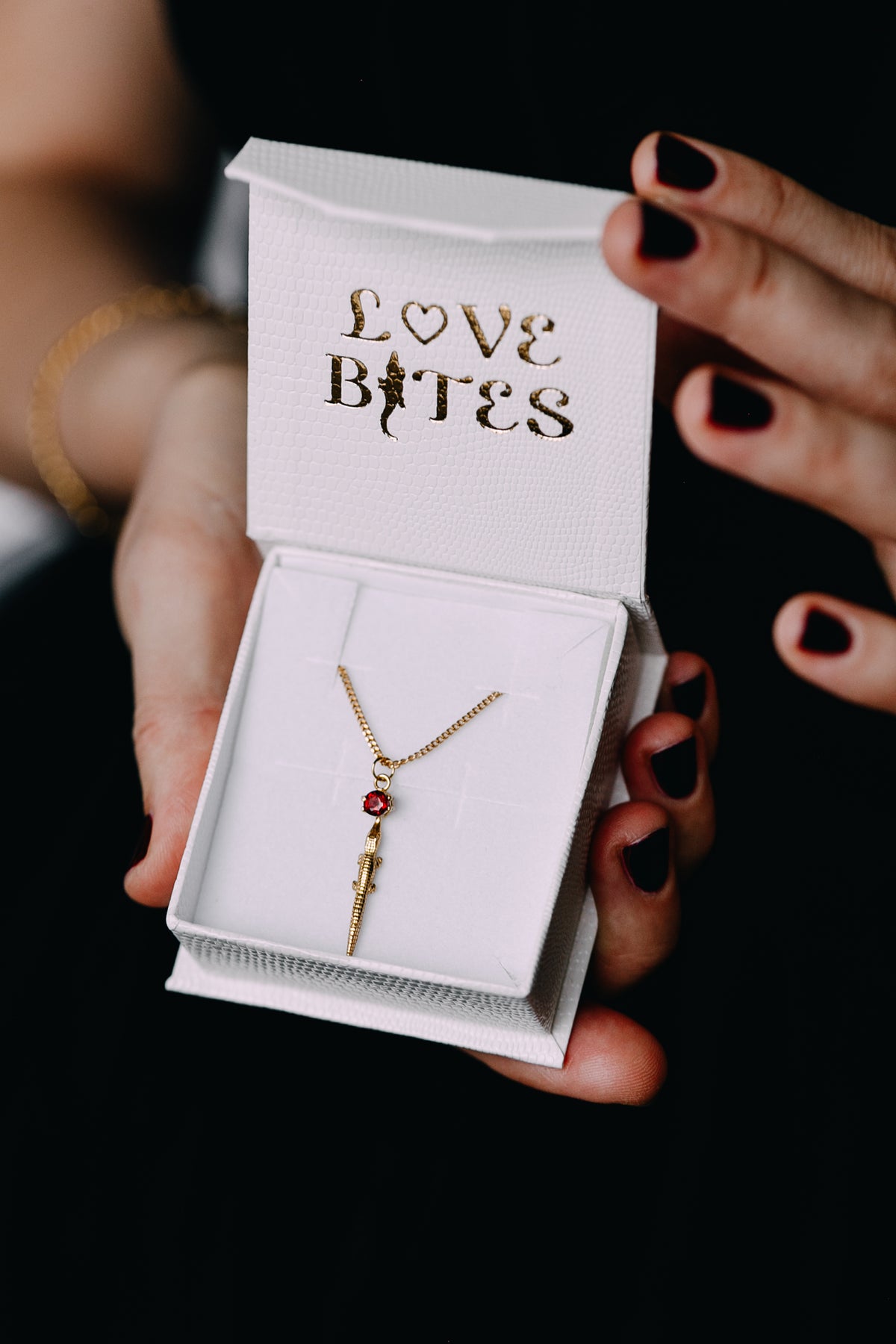 Alligator in 18 k gold plated on silver with a garnet stone. By Carolinne B 