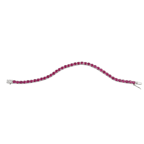 A silver tennis bracelet featuring a curved line of round-cut deep pinkish-red gemstones, displayed on a clean white background.