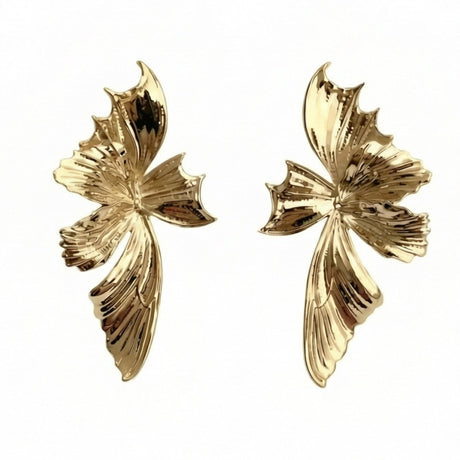 Pair of silver butterfly-shaped earrings on a white background