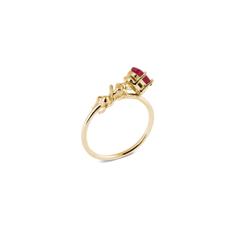 An 18 k gold plated silver ring with a small sculpted ant carrying a bright pink ruby.