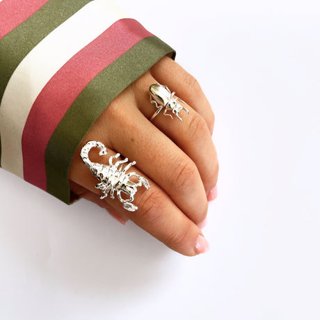 Model wearing silver beetle ring, nature-inspired jewelry by Carolinne B