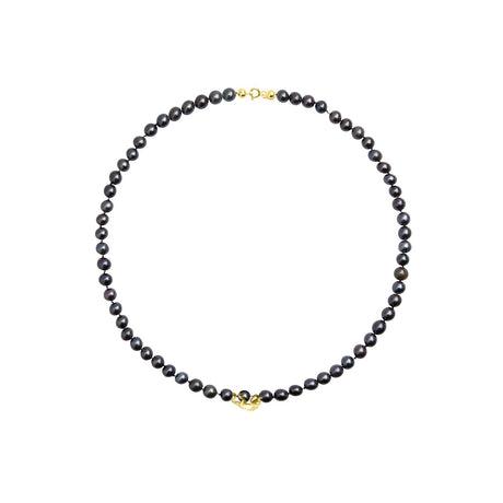 This sculptural chameleon necklace in gold is set with deep black pearls, symbolizing transformation and power. Handcrafted in Stockholm, it blends wild nature with refined luxury.