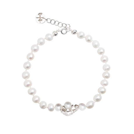 A silver bracelet with a chameleon design wrapped around it, hanging from a strand of white freshwater pearls with an adjustable clasp.