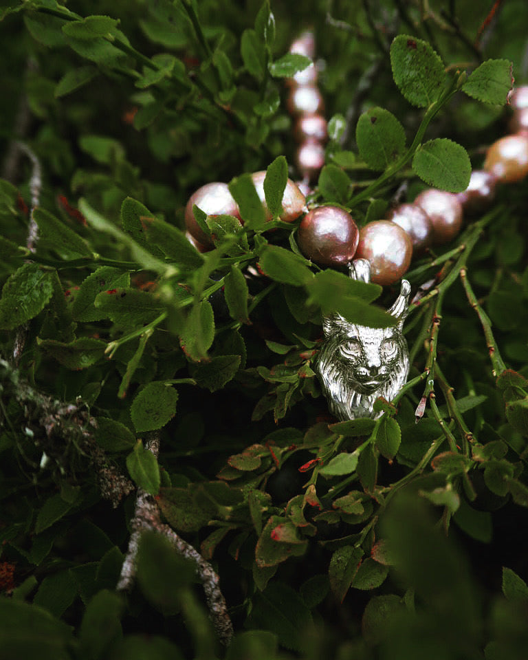 Purple pearls detail on Lynx Pearl Necklace, handmade Scandinavian animal jewelry, statement necklace by Carolinne B