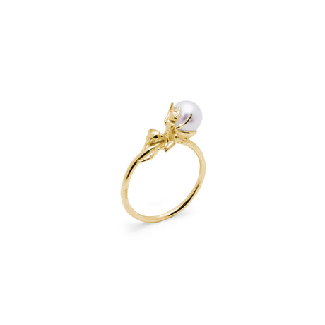 An 18k gold plated silver ring with a sculpted ant design holding a natural freshwater pearl.